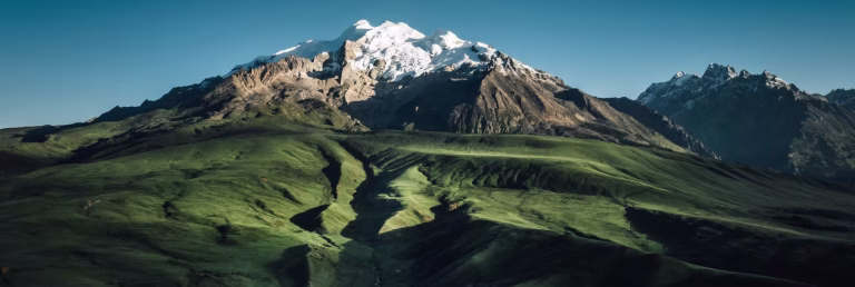 A mountain range with snow on the peaks